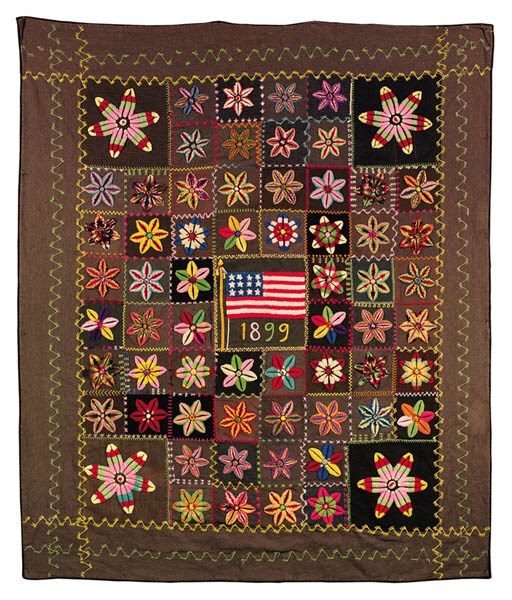 A PIECED AND EMBROIDERED WOOL COVERLET