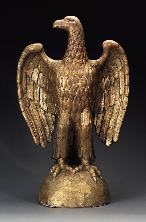 A CARVED AND GILTWOOD EAGLE