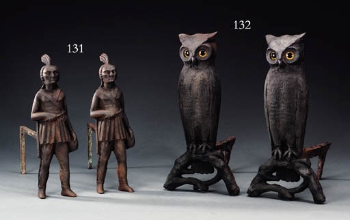 A PAIR OF CAST IRON OWL ANDIRONS