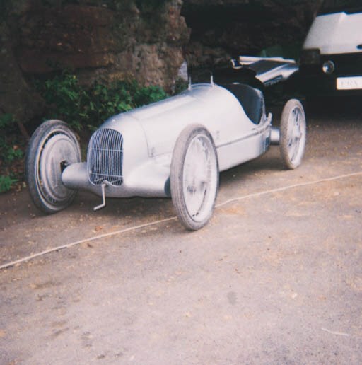 Mercedes-Benz W25 - A good children's motorized model of the pre-war Grand Prix car made legendary by Caracciola, Von Brauchitsch and Fagioli etc; beautifully constructed on steel chassis with silver-painted alloy panelled single-seater bodywork; pneumatic tyres on wire-spoked wheels, with four wheel brakes, Louvred bonnet, outside exhaust and fold-flat windshield; powered by a 49cc motocycle engine with electric start and centrifugal clutch; a fine example of the model makers skills. length approximately 8ft. (2.4m).