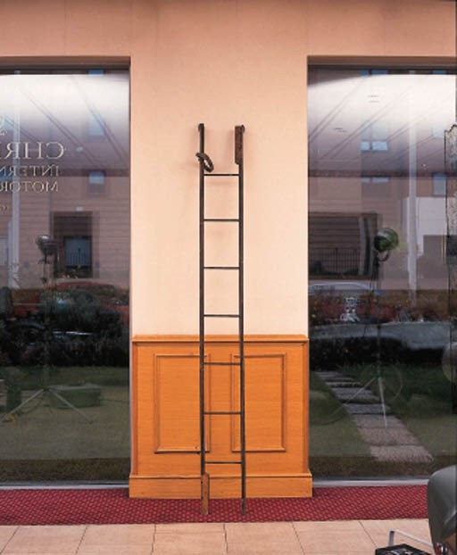 A rare Edwardian folding luggage ladder - elm wood on wrought-iron frame with inset metal rungs; triple folding sections with hooks for attachement to motor car luggage rack and leather binding strap with carrying handle; length extended 108ins (276cm), folded 36in(92cm) English Patent c 1908.