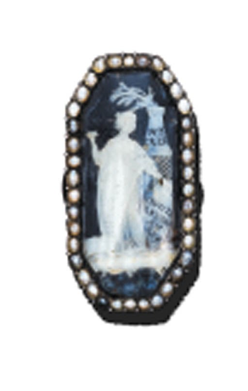 A HALF-PEARL AND ROCK CRYSTAL COMMEMORATIVE RING