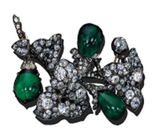 A DIAMOND AND EMERALD FLORAL BROOCH