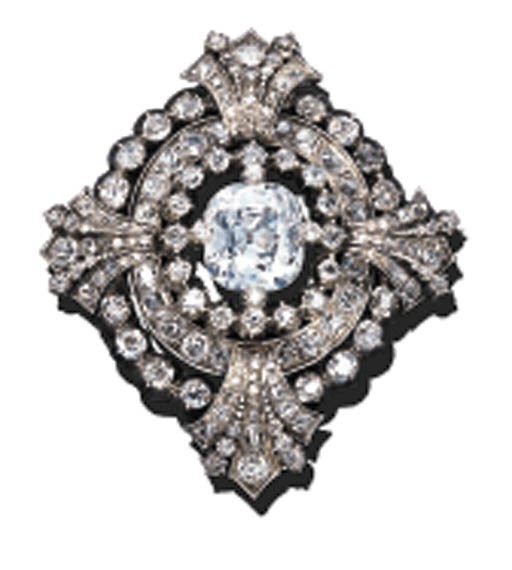 A DIAMOND OVAL MEDALLION BROOCH