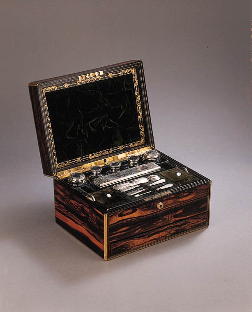 A rosewood veneered toilet-case with silver and glass implements