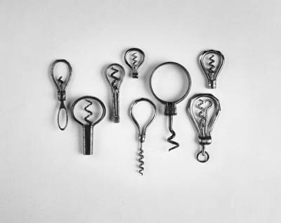 Eight miniature steel perfume or medicine bows: