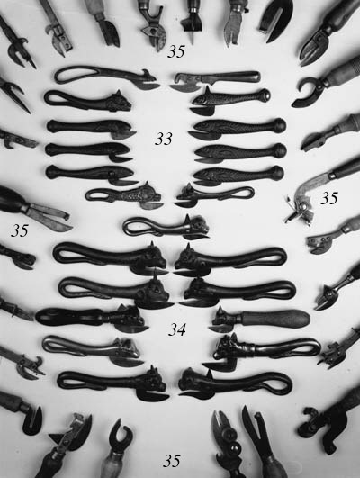 ELEVEN CAST IRON BULLS HEAD TIN OPENERS
