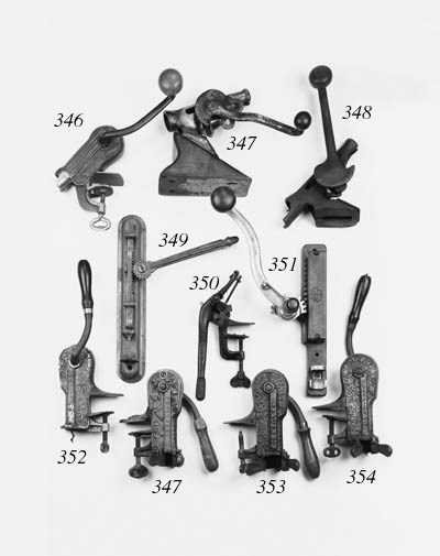 A FRENCH CAST IRON AND ALUMINIUM WALL MOUNTED BAR CORKSCREW,