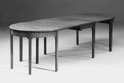 A mahogany D-end extending dining table, parts early 19th century