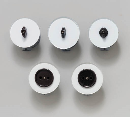 A GROUP OF LIGHT SWITCHES AND OUTLETS