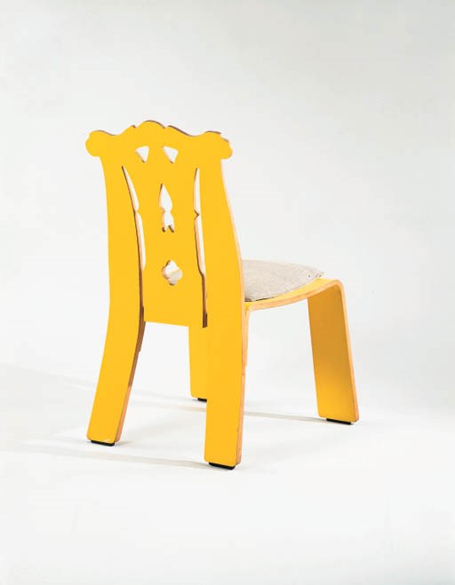 A 'CHIPPENDALE' YELLOW LAMINATED PLYWOOD SIDE CHAIR