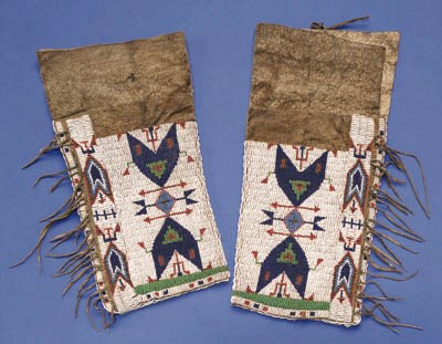 A PAIR OF SIOUX WOMAN'S BEADED HIDE LEGGINGS