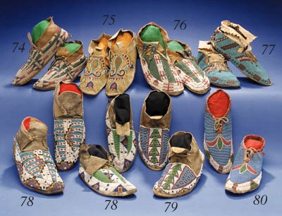 A PAIR OF CROW BEADED HIDE MOCCASINS