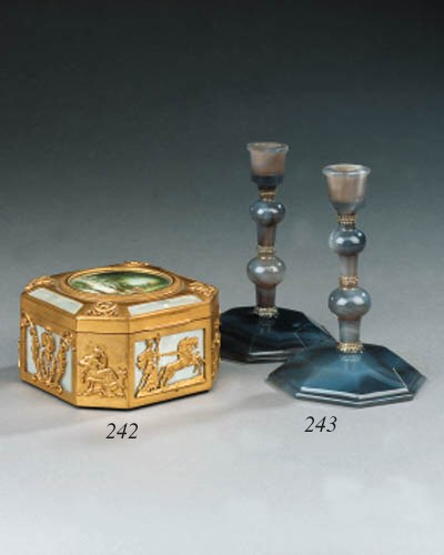 A pair of silver mounted agate candlesticks, early 20th century