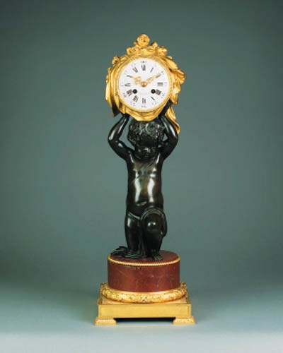 A French bronze and ormolu striking mantel clock, dated 1881