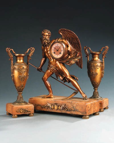 A Restauration ormolu and yellow marble striking mantel clock, first quarter 19th century