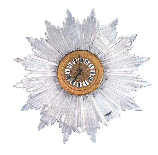 A LOUIS XV STLE CUT GLASS AND GILT METAL SUNBURST-FORM WALL CLOCK