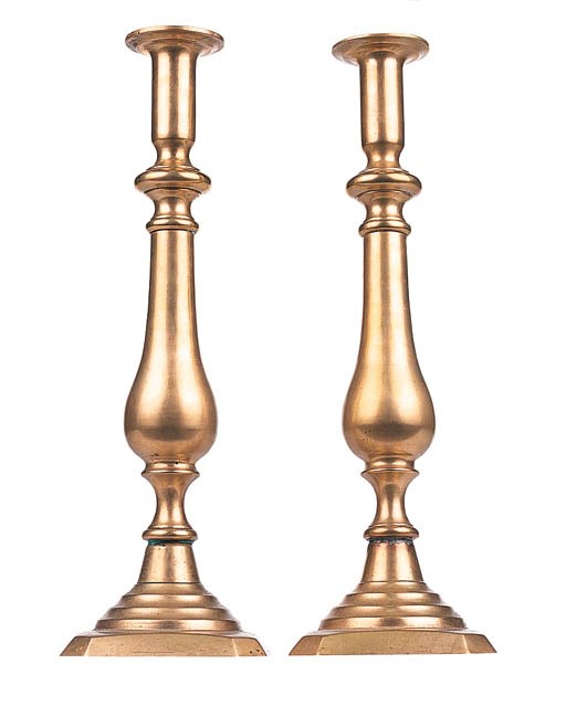 A PAIR OF BRASS TABLE CANDLESTICKS