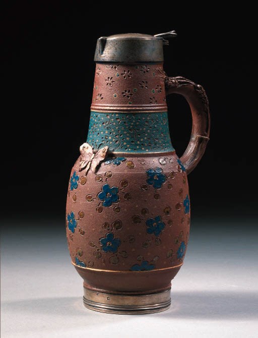 a silver-mounted stoneware jug