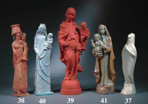 A glazed pottery figure of the Madonna with Child