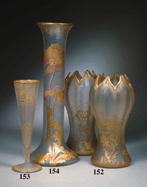 An etched and gilded glass vase