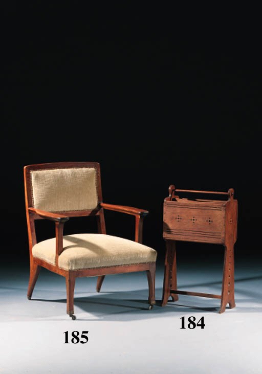 A CARVED AND EBONY AND PALMWOOD INLAID OAK MAGAZINE STAND