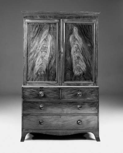 A late George III mahogany linen press