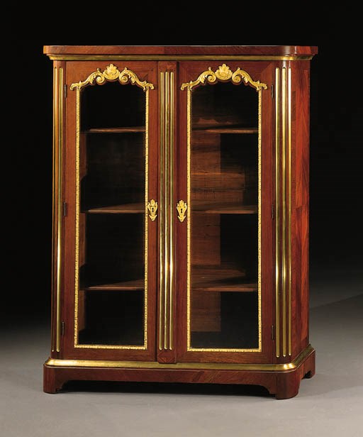 AN EARLY LOUIS XV ORMOLU-MOUNTED AMARANTH BIBLIOTHEQUE