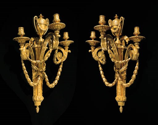 A PAIR OF LOUIS XVI ORMOLU THREE-BRANCH WALL-LIGHTS