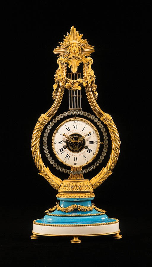 A LOUIS XVI ORMOLU AND SEVRES BLEU CELESTE PORCELAIN LYRE-SHAPED MANTEL CLOCK