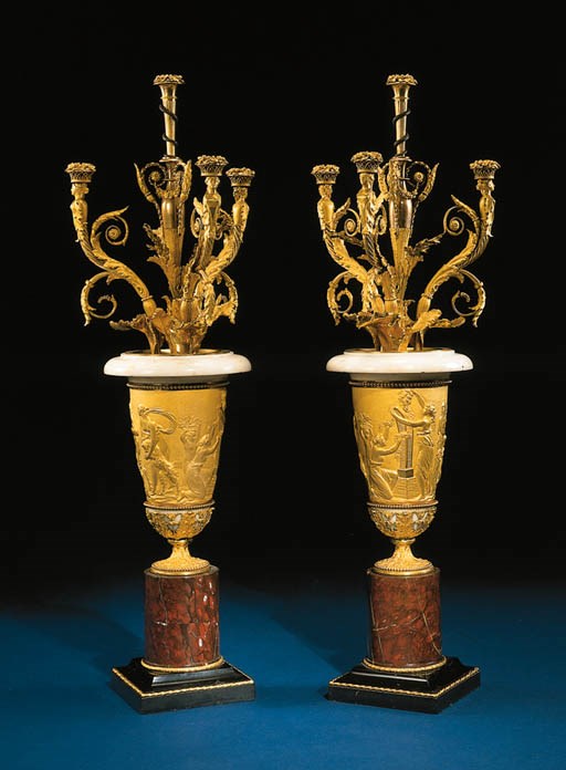 A PAIR OF LOUIS XVI ORMOLU AND WHITE, BLACK AND RED GRIOTTE MARBLE FOUR-LIGHT CANDELABRA