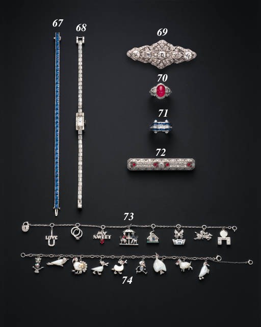 AN ATTRACTIVE ART DECO DIAMOND AND RUBY BROOCH