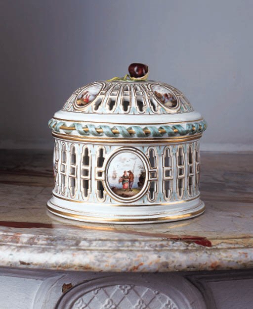 A Meissen pierced chestnut basket and domed cover