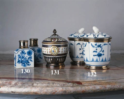 A pair of Meissen shaped rectangular silver-gilt-mounted teacaddies and silver-gilt covers