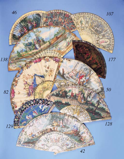 A Canton brise fan, painted with a family at tea on an island and a man and a horse, with a frieze of birds, animals and fish, the verso with three figures with a horse, with a frieze of birds and animals, the guardsticks with dragons - 8in. (20cm.), circa 1820