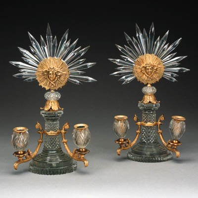 A near pair of Regency glass and ormolu twin light candelabra