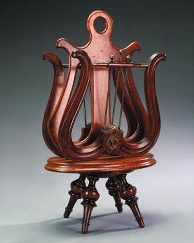 A late Victorian or Edwardian oak music sheet stand, circa 1900