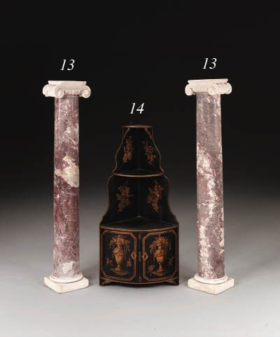 A PAIR OF NEOCLASSIC FLEUR-DE-PECHE AND WHITE MARBLE IONIC COLUMNS