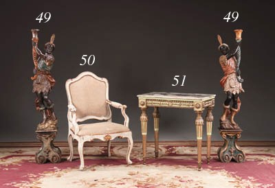 A PAIR OF ITALIAN BAROQUE STYLE POLYCHROME-DECORATED AND PARCEL-GILT BLACKAMOOR TORCHERES
