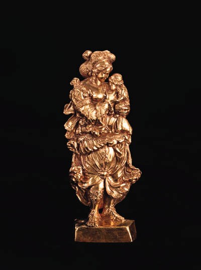A REPOUSSÉ GOLD RELIEF FIGURE OF CHARITY