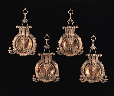 A SET OF FOUR EMPIRE STYLE ORMOLU ANBD PATINATED BRONZE SIX-LIGHT WALL LIGHTS