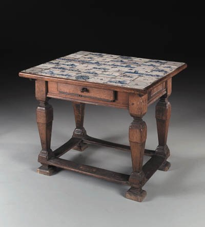 A DUTCH BAROQUE OAK AND DELFTWARE TILE CENTER TABLE