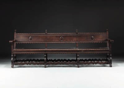 A SPANISH LATE RENAISSANCE WROUGHT-IRON-MOUNTED WALNUT BENCH