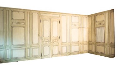 A REGENCE GREEN-PAINTED WOOD-PANELLED SALON