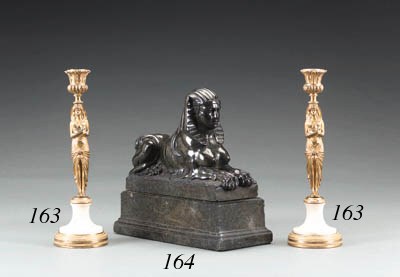 AN ITALIAN NEOCLASSIC GREEN SERPENTINE MARBLE SPHINX