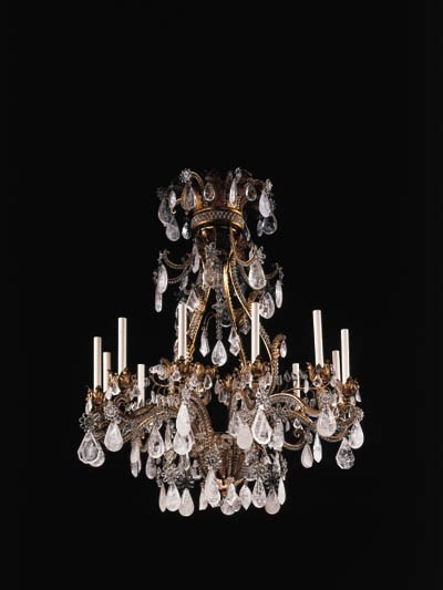 A LOUIS XV STYLE ROCK CRYSTAL AND GILT-METAL TWELVE-LIGHT CHANDELIER