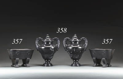 A PAIR OF ITALIAN NEOCLASSIC STYLE BLACK MARBLE TWO-HANDLED URNS