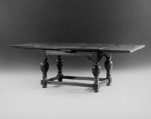 A DUTCH BAROQUE OAK DRAW-LEAF TABLE