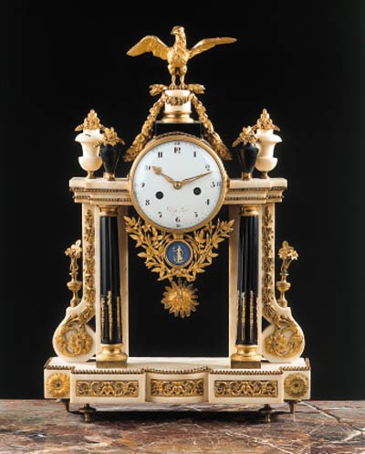 A louis XVI ormolu-mounted black and white marble mantel clock
