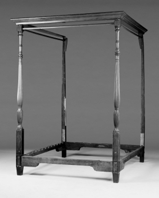 A mahogany and line-inlaid four poster bed, parts early 19th century
